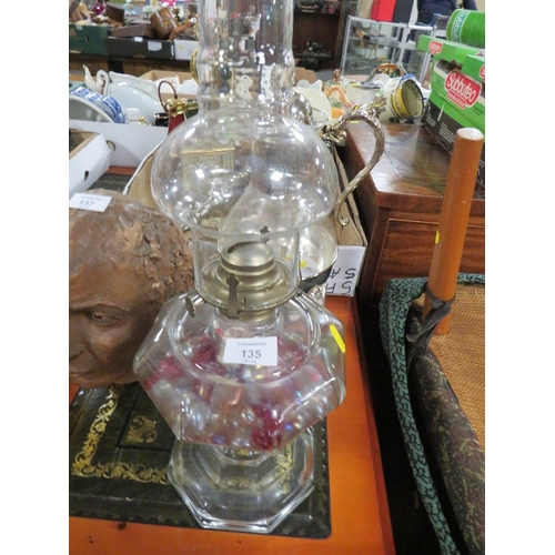 135 - A UNUSUAL BRASS STYLE OIL LAMP TOGETHER WITH A SILVER PLATED DECANTER AND STAND