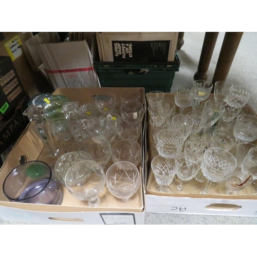 153 - TWO TRAYS OF GLASSWARE TO INCLUDE DRINKING GLASSES , CANDLESTICKS ETC
