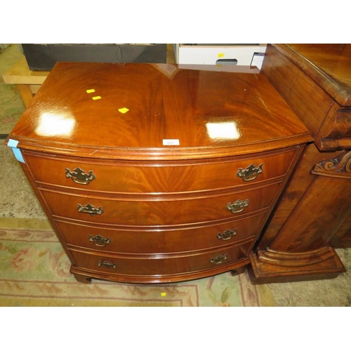 802 - A WALNUT BOW FRONTED FOUR DRAWER CHEST - W 79 cm