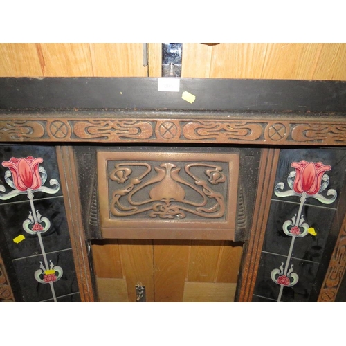 805 - A CAST IRON FIRE SURROUND WITH TUBELINED TILES