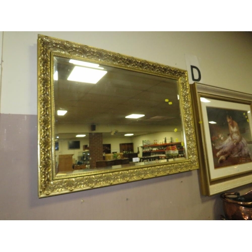 823 - A LARGE MODERN GILT FRAMED MIRROR