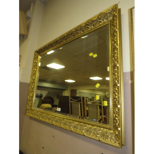 823 - A LARGE MODERN GILT FRAMED MIRROR