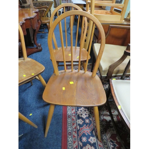 827 - A SET OF FOUR ERCOL STYLE HOOP BACK CHAIRS