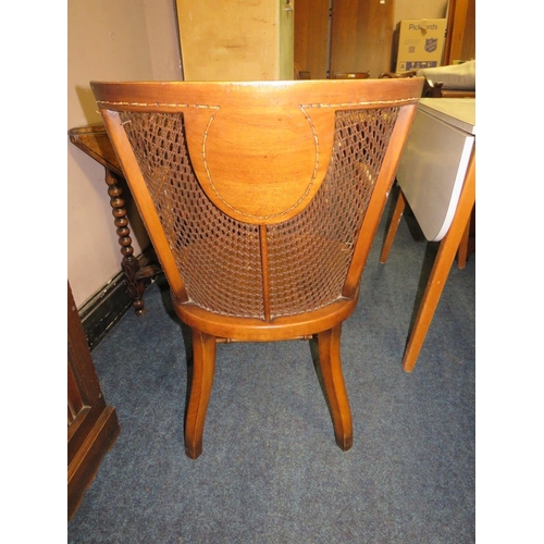 831 - A VINTAGE WALNUT BERGERE ARMCHAIR