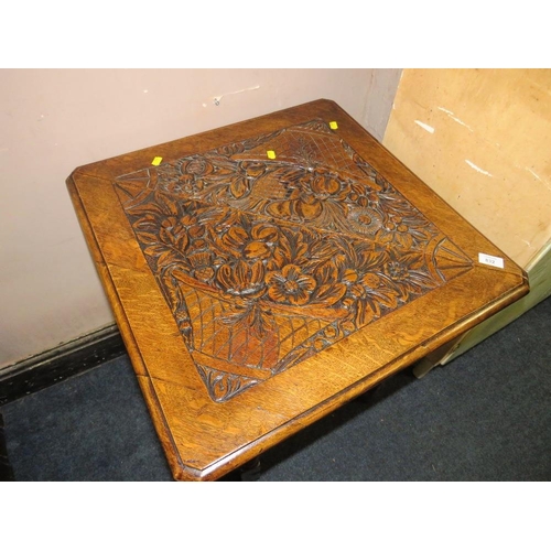 832 - AN ANTIQUE OAK CARVED DROP LEAF TABLE