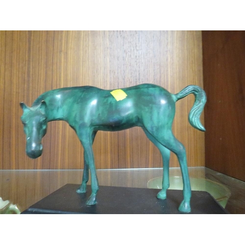 199 - A CAST METAL MODEL OF A HORSE ON A PLINTH