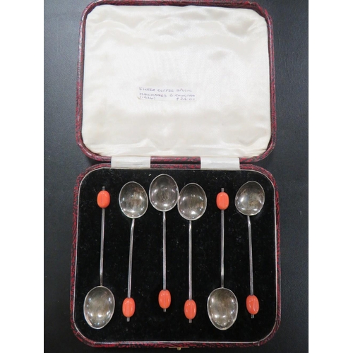 301 - A CASED SET OF HALLMARKED SILVER COFFEE BEAN SPOONS WITH PINK FINIALS