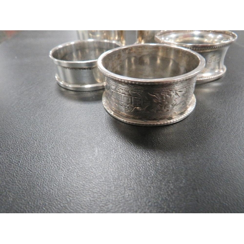 305 - FIVE HALLMARKED SILVER NAPKIN RINGS