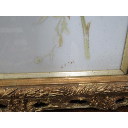 42 - A PAIR OF VICTORIAN GILT FRAMED FLORAL PAINTINGS ON GLASS (2)