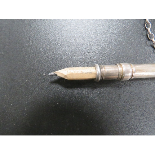 316 - AN ANTIQUE SILVER EXTENDING PENCIL BY SAMSON MORDEN ON SILVER CHAIN