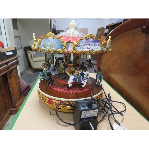 106A - A MR CHRISTMAS TRIPLE DECKER TWELVE HORSE MUSICAL CAROUSEL, Dia. 25 cm, COMPLETE WITH LEAD, IN WORKI... 