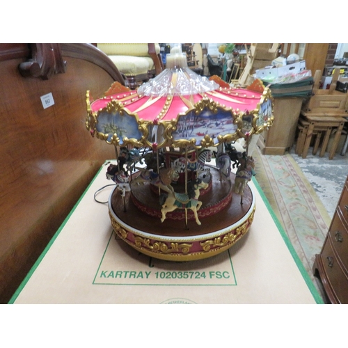 106A - A MR CHRISTMAS TRIPLE DECKER TWELVE HORSE MUSICAL CAROUSEL, Dia. 25 cm, COMPLETE WITH LEAD, IN WORKI... 
