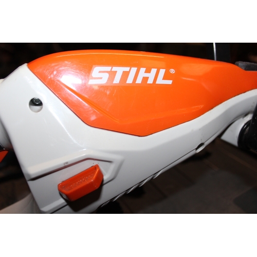 714 - A RECHARGEABLE STIHL STRIMMER TOGETHER WITH TWO CORDLESS BOSCH DRILLS