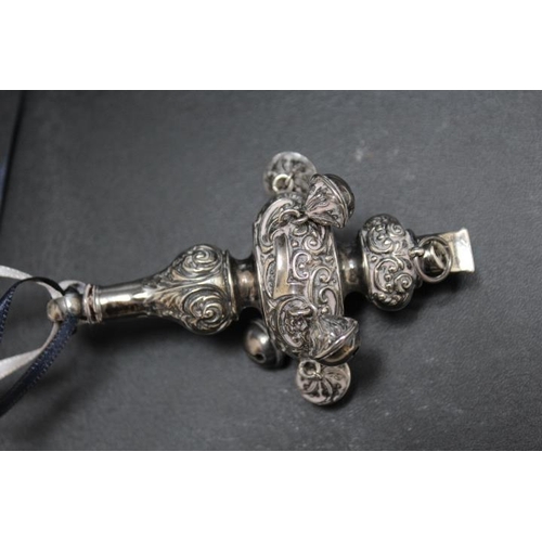 231 - A HALLMARKED SILVER BABY'S RATTLE WITH WHISTLE BY CRISFORD & NORRIS LTD - BIRMINGHAM 1917, adorned w... 