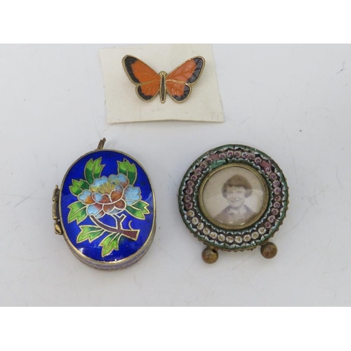 237 - A MINIATURE CIRCULAR MICRO MOSAIC PICTURE FRAME, together with an enamelled butterfly brooch and a c... 