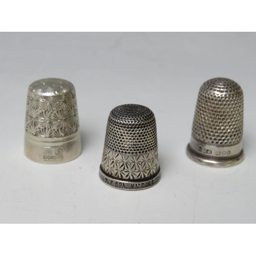 238 - A CHARLES HORNER WHITE METAL THIMBLE, together with a Charles Horner hallmarked silver thimble and a... 