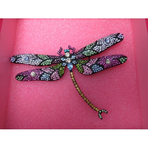 255 - A COLLECTION OF SIX BUTLER AND WILSON JEWELLERY ITEMS, to include a large dragonfly brooch - W 10 cm... 