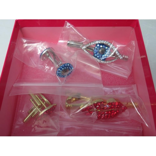 256 - A COLLECTION OF SEVEN BUTLER AND WILSON JEWELLERY ITEMS, to include a 'lips' cufflinks and tie pin s... 