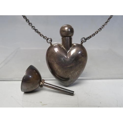 273 - A BOXED PENHALIGON'S HEART SHAPED PERFUME BOTTLE PENDANT, the bottle marked 925, complete with stopp... 