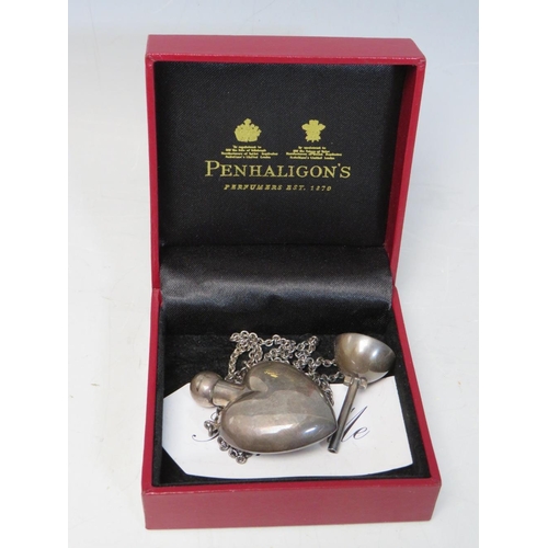 273 - A BOXED PENHALIGON'S HEART SHAPED PERFUME BOTTLE PENDANT, the bottle marked 925, complete with stopp... 