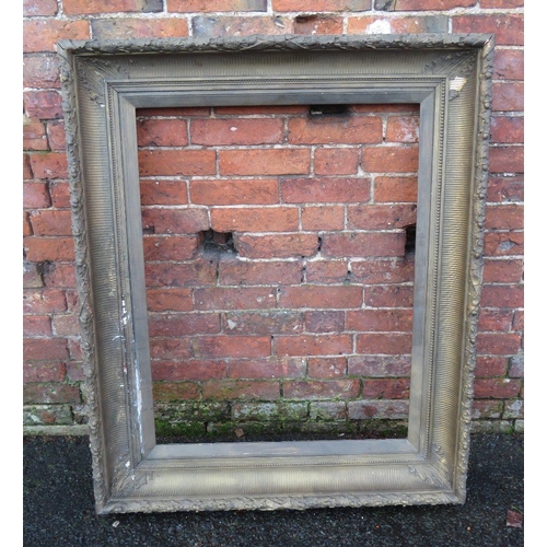 28 - A GILT RECTANGULAR PICTURE FRAME, with acorn moulding and slip, rebate 90 x 70 cm
