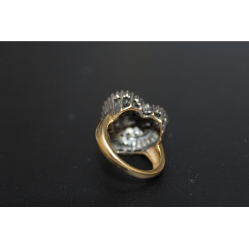 290 - A HALLMARKED 18 CARAT GOLD HEART SHAPED DIAMOND CLUSTER RING,  set with a combination of baguette an... 