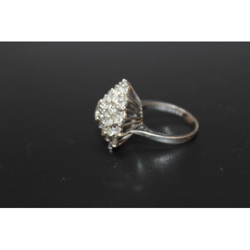 291 - A HALLMARKED 18 CARAT WHITE GOLD DIAMOND CLUSTER RING, set with five rows of brilliant cut diamonds ... 