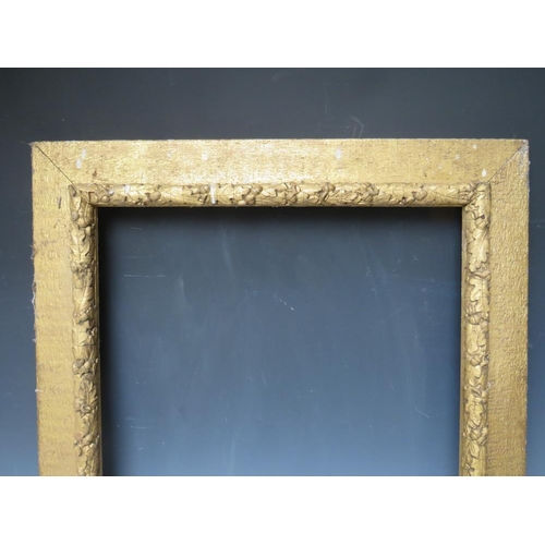 32 - A 19TH CENTURY ART AND CRAFTS GOLD FRAME, with acorn leaf design, frame W 9 cm, rebate 59.5 x 47.5 c... 