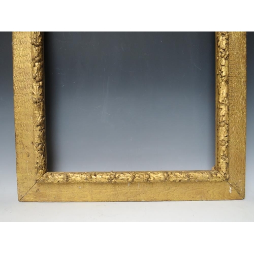 32 - A 19TH CENTURY ART AND CRAFTS GOLD FRAME, with acorn leaf design, frame W 9 cm, rebate 59.5 x 47.5 c... 