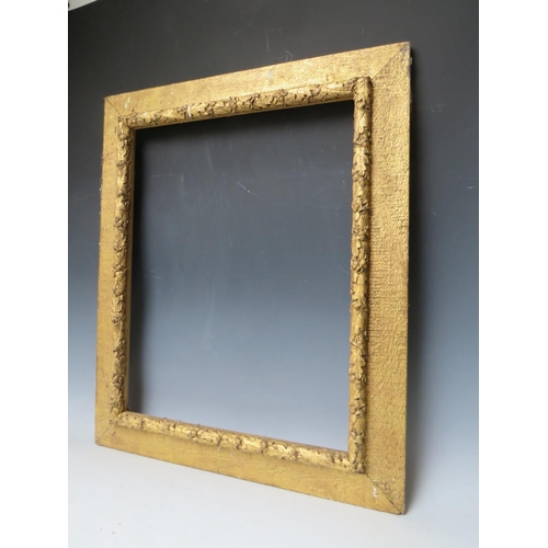 32 - A 19TH CENTURY ART AND CRAFTS GOLD FRAME, with acorn leaf design, frame W 9 cm, rebate 59.5 x 47.5 c... 