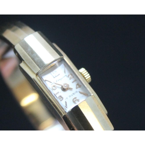 344 - A CONTINENTAL 585 GOLD CLASP BANGLE WRIST WATCH, approx weight 17.1g, W 1 cmCondition Report:ticks o... 