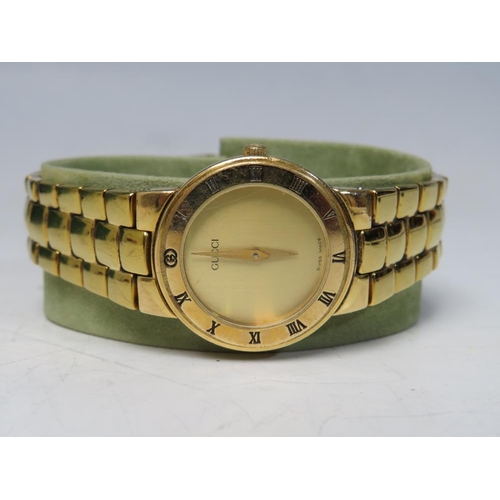 362 - A 1980 / 90'S LADIES GUCCI GOLD PLATED WRISTWATCH, with champagne coloured dial and Roman Numerals t... 