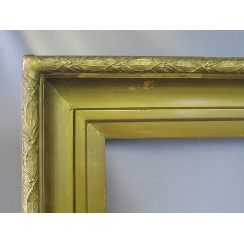 38 - A 19TH CENTURY GOLD FRAME, with gold slip and leaf design to outer edge, having some restoration, fr... 