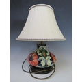 A MODERN MOORCROFT POPPY TABLE LAMP WITH SHADE, designed by Rachel ...