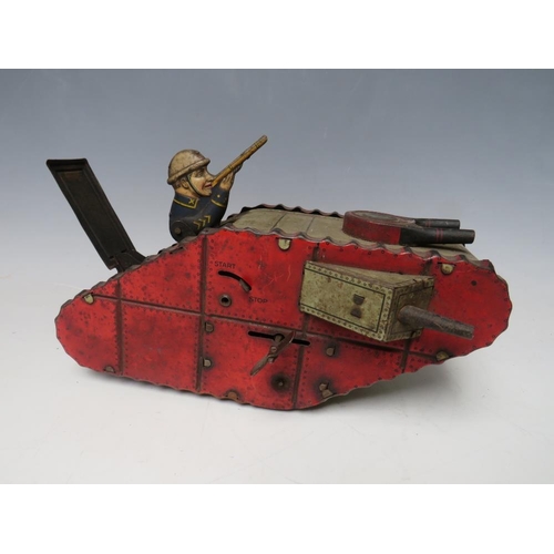 883 - A VINTAGE TINPLATE CLOCKWORK FIRST WORLD WAR TANK, with figure inside, L 24 cm