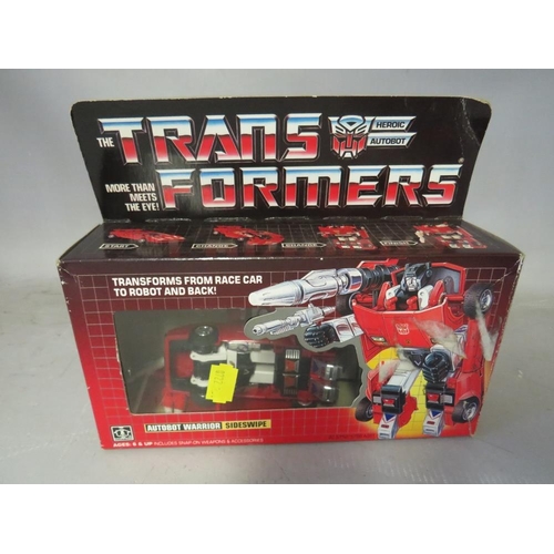 893 - FIVE BOXED HASBRO TRANSFORMERS TO INCLUDE SCATTERSHOT, Slag, Sideswipe, Jazz and Duocon Flywheels