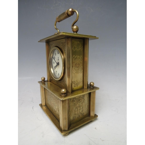 900 - A SMALL BRASS CASED MUSICAL ALARM CLOCK, playing Brahms 'Lullaby For Babies'