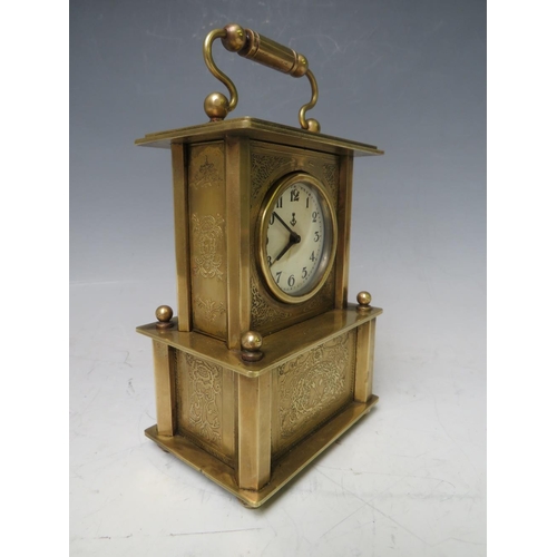 900 - A SMALL BRASS CASED MUSICAL ALARM CLOCK, playing Brahms 'Lullaby For Babies'