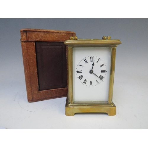 904 - A SMALL FRENCH BRASS CARRIAGE CLOCK, held in a red Moroccan leather travelling case, with Key, H 14 ... 