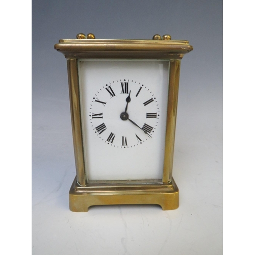 904 - A SMALL FRENCH BRASS CARRIAGE CLOCK, held in a red Moroccan leather travelling case, with Key, H 14 ... 