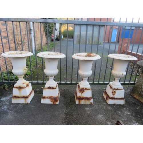 958 - A SET OF FOUR WHITE PAINTED CAST URNS ON STANDS, H 89 cm (4)