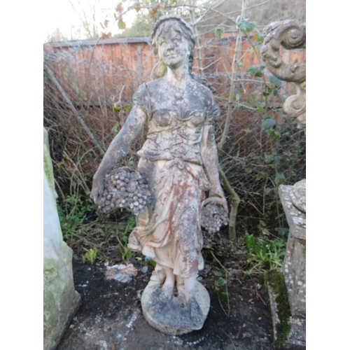 963 - A LARGE STONE STATUE OF A LADY WITH A BASKET OF FRUIT IN HER LEFT HAND, H 152 cm (Note - Heavy)