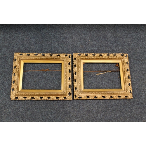 31 - A PAIR OF 19TH CENTURY GOLD DECORATIVE PIERCED FRAMES, frame W 5 cm, slip rebate 20 x 28 cm, frame r... 