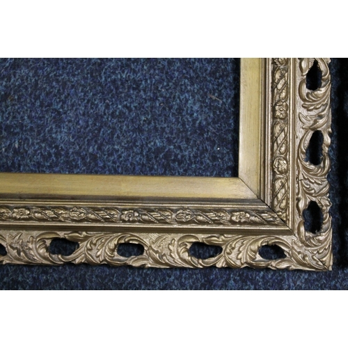 31 - A PAIR OF 19TH CENTURY GOLD DECORATIVE PIERCED FRAMES, frame W 5 cm, slip rebate 20 x 28 cm, frame r... 