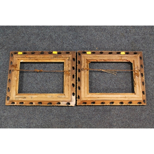 31 - A PAIR OF 19TH CENTURY GOLD DECORATIVE PIERCED FRAMES, frame W 5 cm, slip rebate 20 x 28 cm, frame r... 