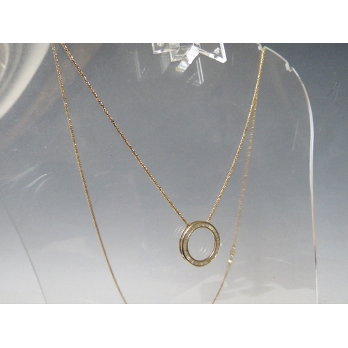 247 - A HALLMARKED 9CT GOLD CIRCULAR CHANNEL SET DIAMOND PENDANT, on a gilt 925 silver chain