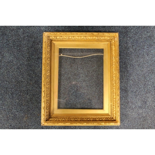 35 - A 19TH CENTURY GOLD FRAME, with acanthus leaf design and gold slip, glazed, frame W 5.5 cm, slip reb... 