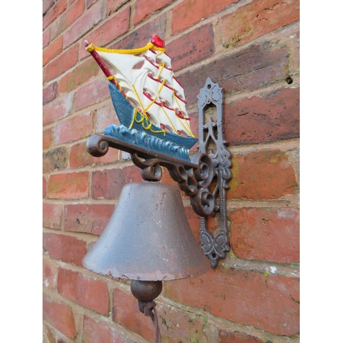 117 - THREE CAST WALL MOUNTED SHIPS BELLS ETC