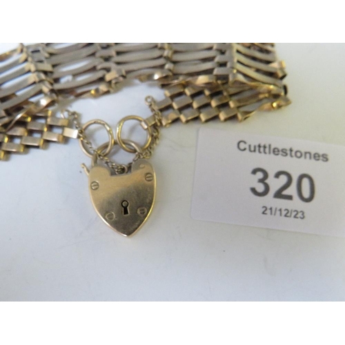 320 - A 9CT GOLD SIX BAR GATE BRACELET, WITH HEART PADLOCK CLASP A/F, APPROX WEIGHT 13.69 G