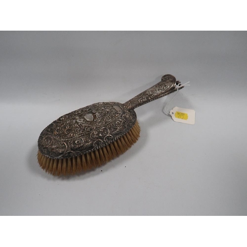 439 - VINTAGE HALLMARKED SILVER BACKED DECORATIVE HAIRBRUSH